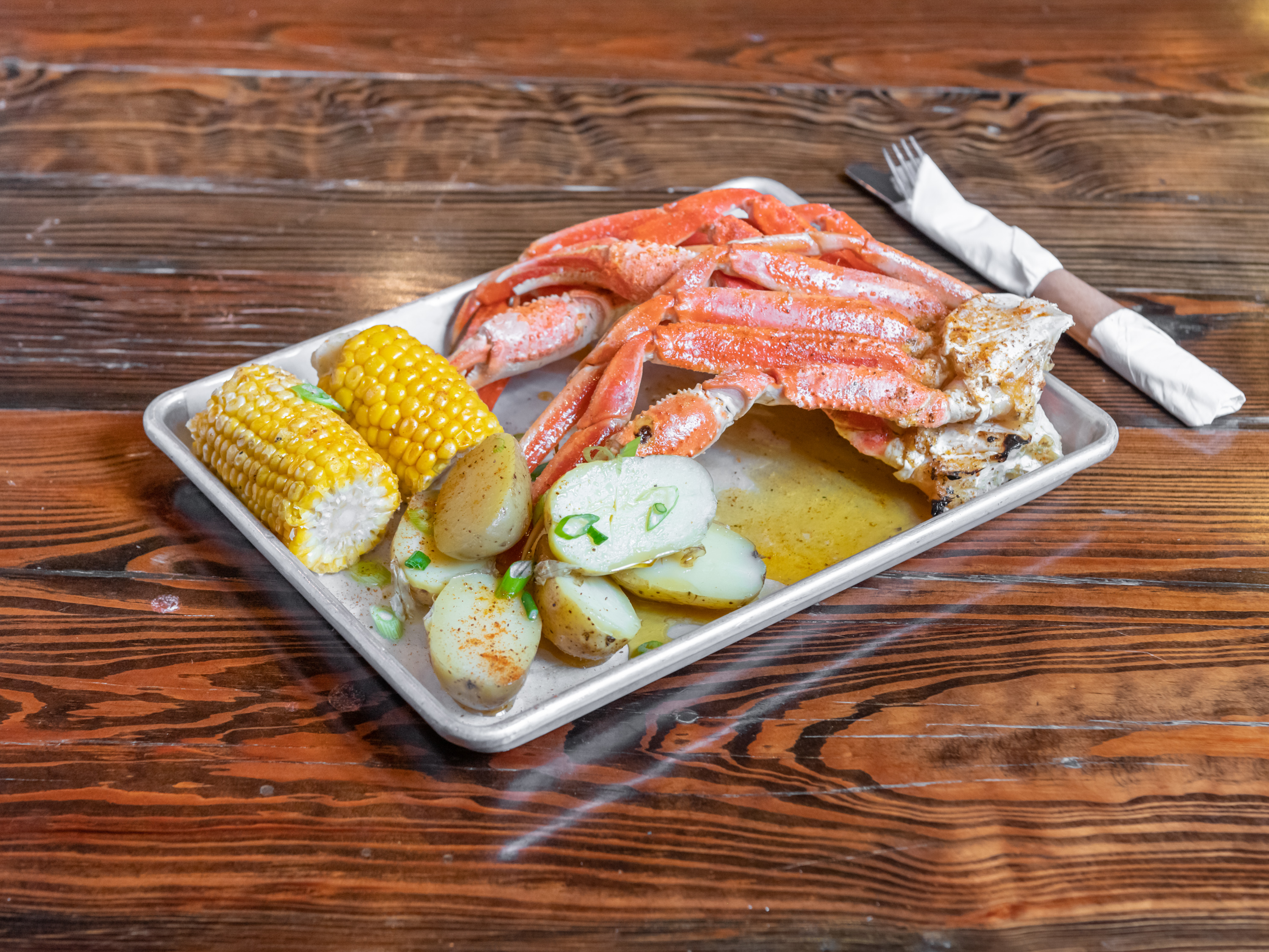 Order Steamed Crab Legs in White Wine Season Butter Sauce food online from The Simpson Restaurant & Bar store, Brooklyn on bringmethat.com