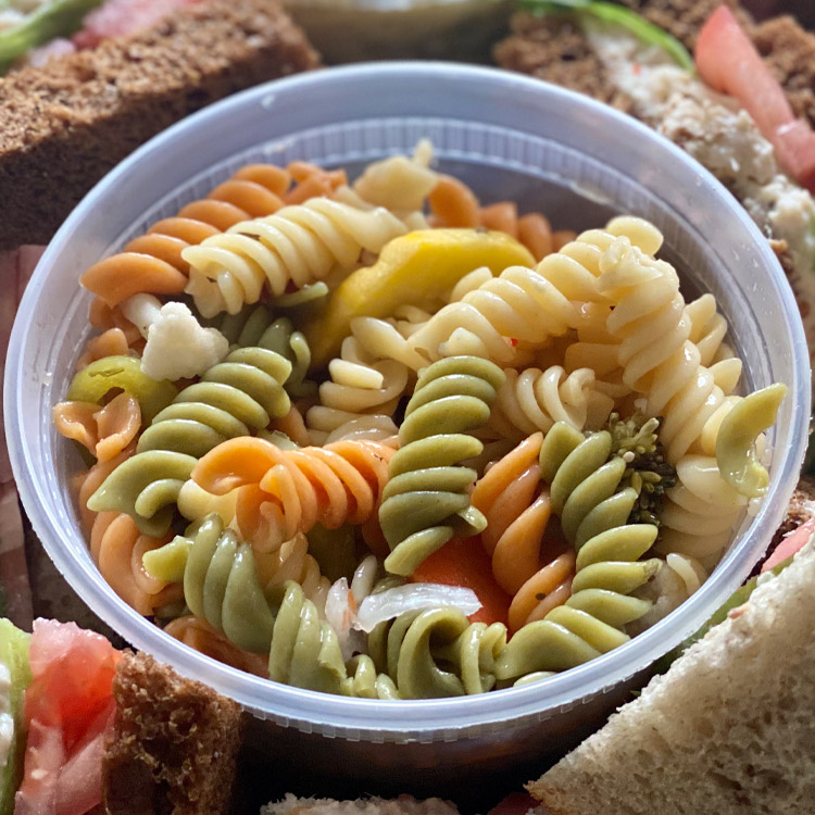 Order *8 oz. Pasta Salad food online from Groucho's Deli store, Spartanburg on bringmethat.com