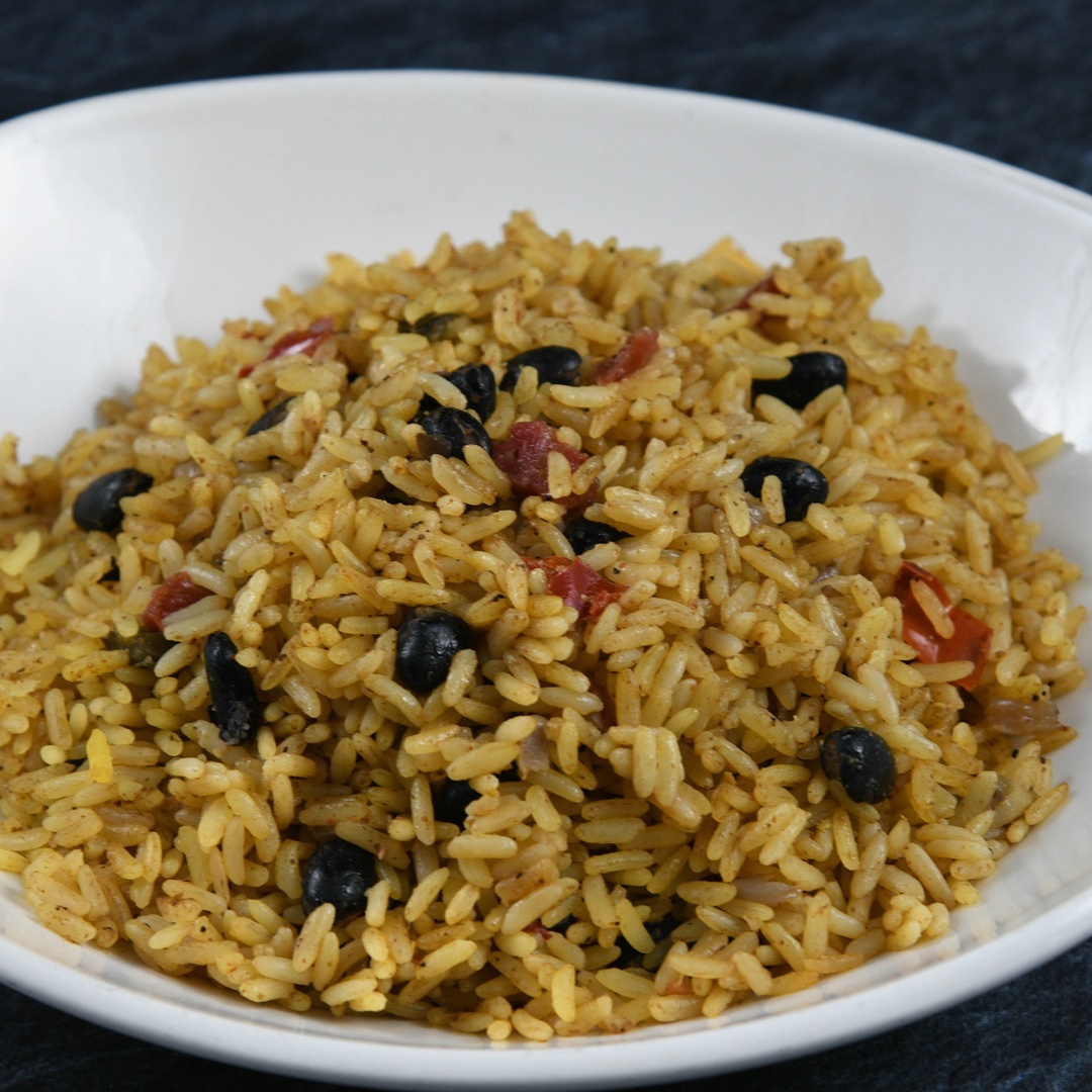 Order Caribbean Rice food online from Rainforest Cafe store, Las Vegas on bringmethat.com
