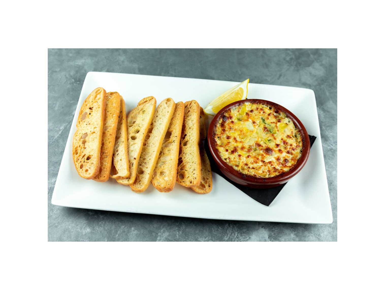 Order Famous Spicy Artichoke Dip food online from Patxi's Chicago Pizza store, San Francisco on bringmethat.com