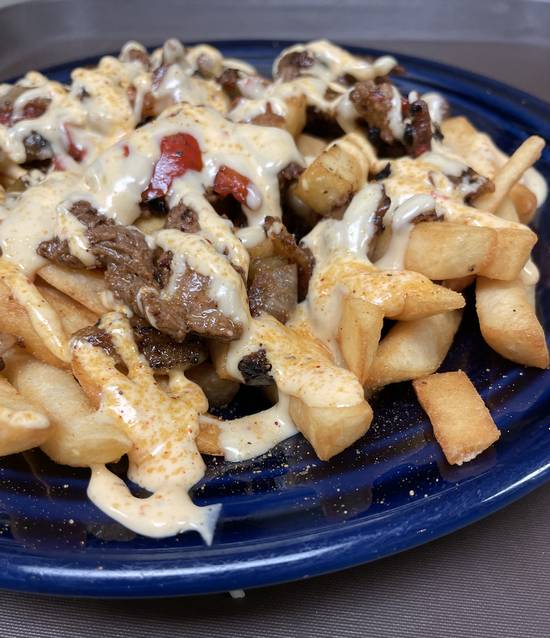 Order Philly Cheesesteak Fries food online from Tios Mexican Cafe store, Columbia on bringmethat.com