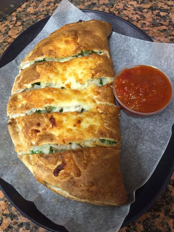 Order Grilled Chicken, Feta & Spinach Calzone - Small food online from Ideal Pizza store, Blackstone on bringmethat.com