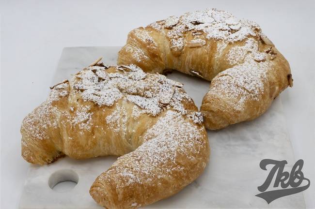 Order ALMOND CROISSANT food online from TKB Bakery & Deli store, Indio on bringmethat.com