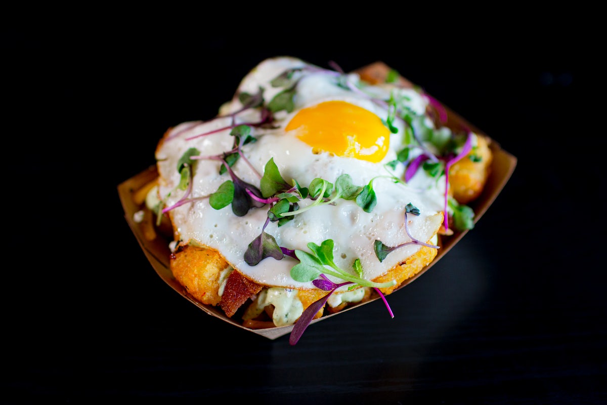 Order Crisp Tots & Local Egg food online from Velvet Taco store, Austin on bringmethat.com