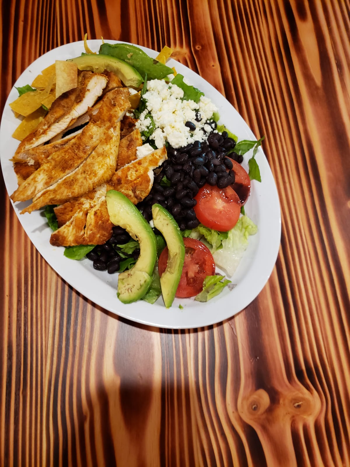 Order Southwest Blackened Chicken Salad food online from Pita Grill store, New York on bringmethat.com