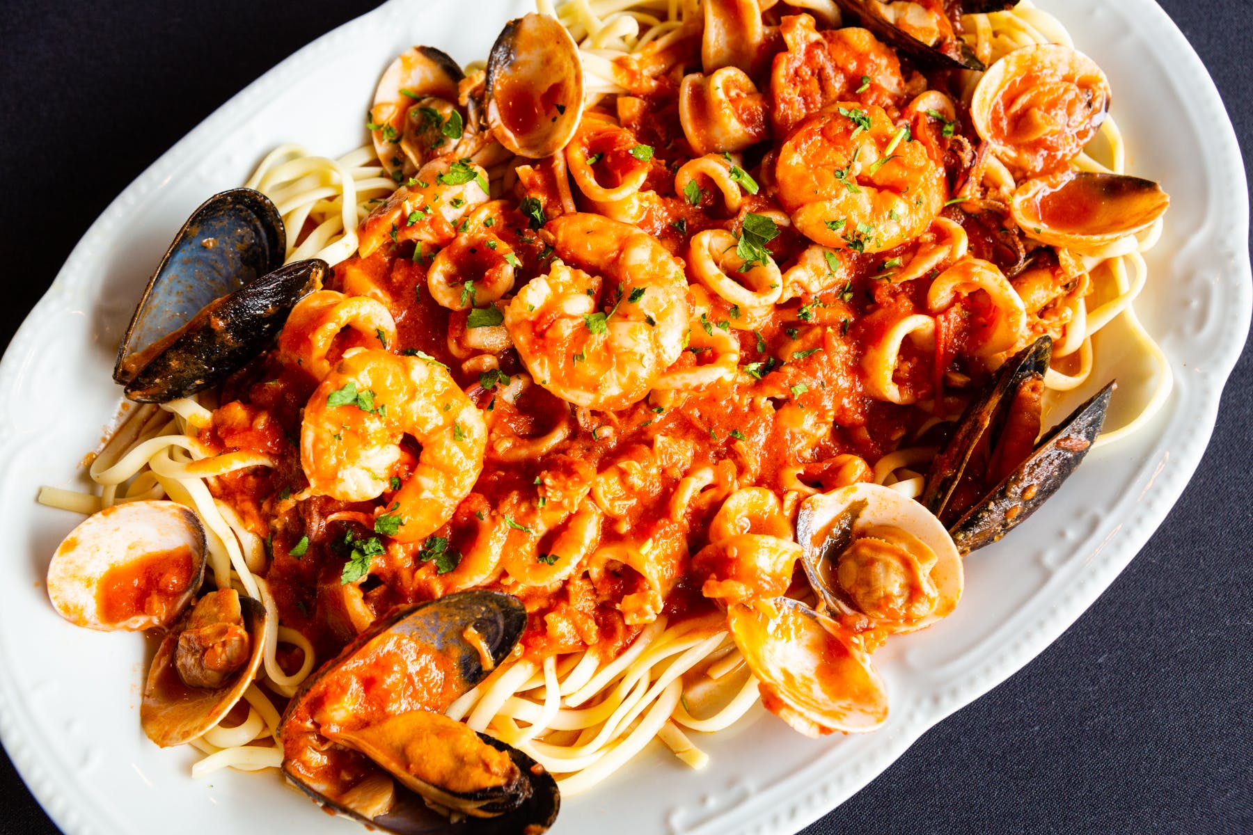 Order Spaghetti with Seafood Combo - Dinner food online from Mona Lisa Pizzeria Ristorante store, Bayonne on bringmethat.com