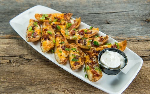 Order Potato Skins - Appetizer food online from Native Grill & Wings store, Phoenix on bringmethat.com