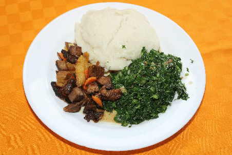 Order 17. Ughali served with fried beef tips and Sukuma wiki food online from Tamu Foods store, Federal Way on bringmethat.com