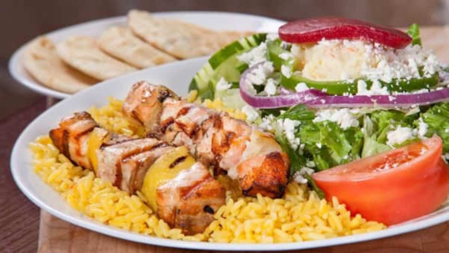 Order Salmon Skewers with Rice & Greek Salad food online from Little Greek Fresh Grill store, Youngstown on bringmethat.com