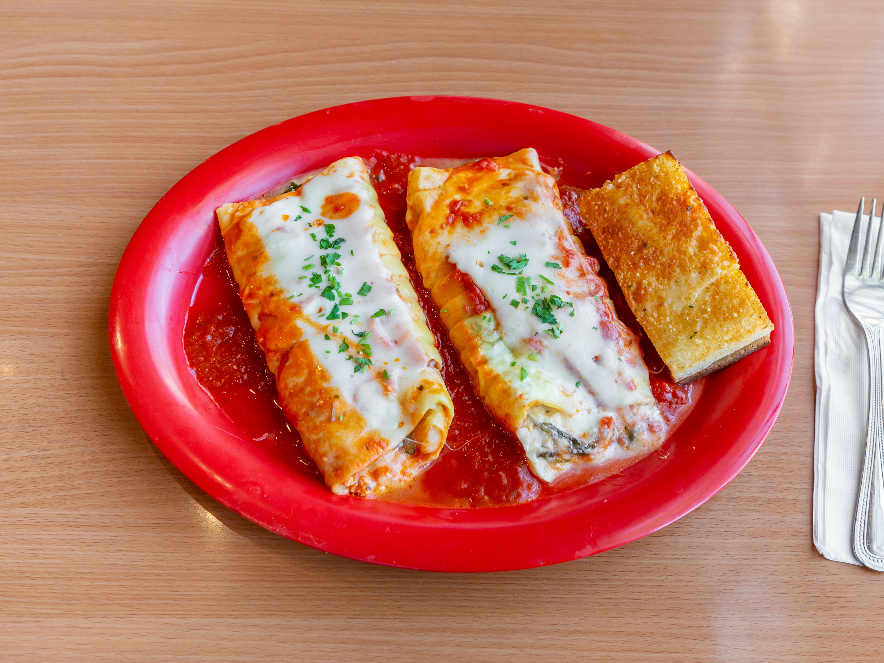 Order Spinach Manicotti food online from Primo Pizza & Pasta store, Carlsbad on bringmethat.com
