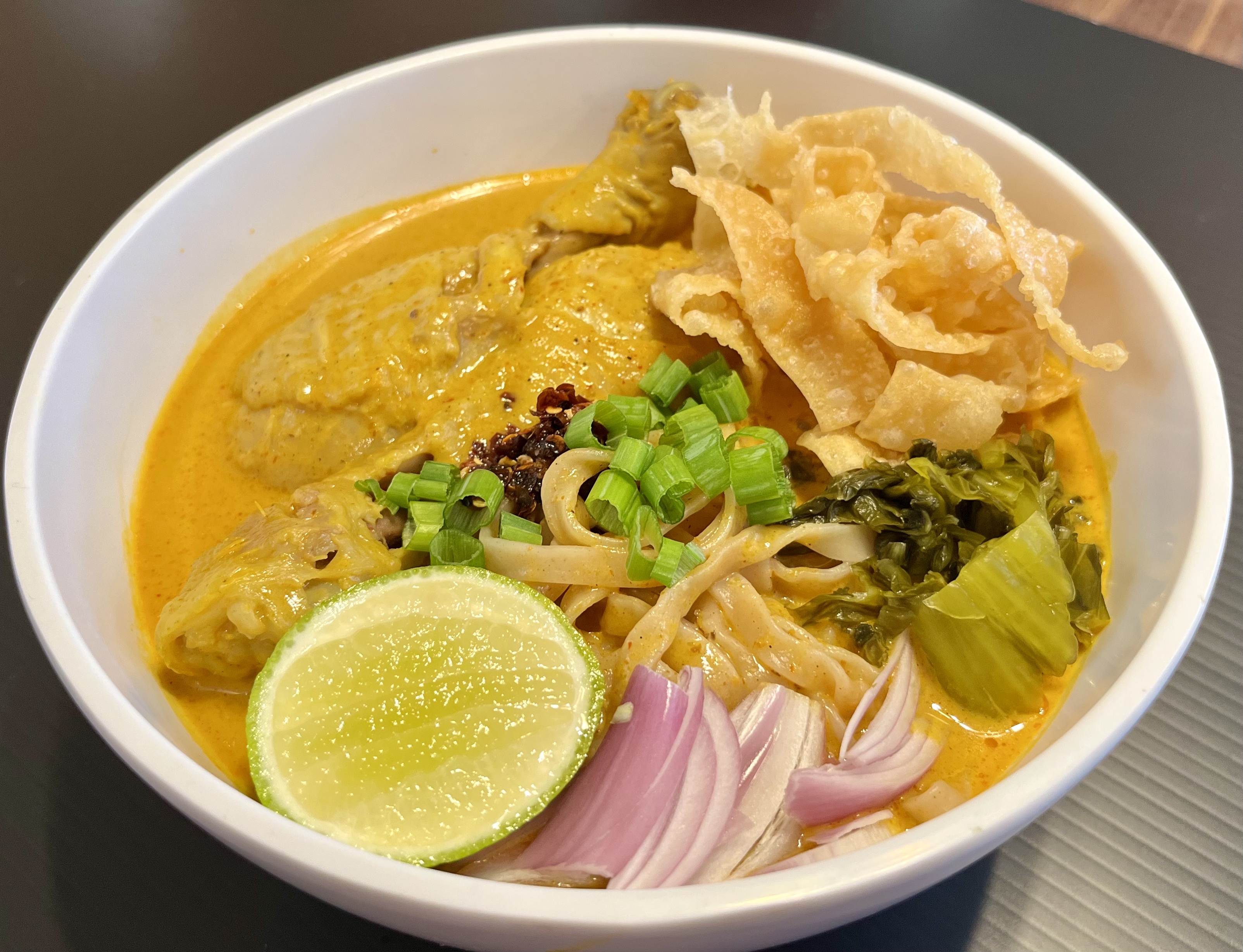 Order Khao Soi Gai (Northern Thai Coconut Curry Noodle Soup with Chicken) NEW !!! food online from Ubon Thai Kitchen store, Torrance on bringmethat.com