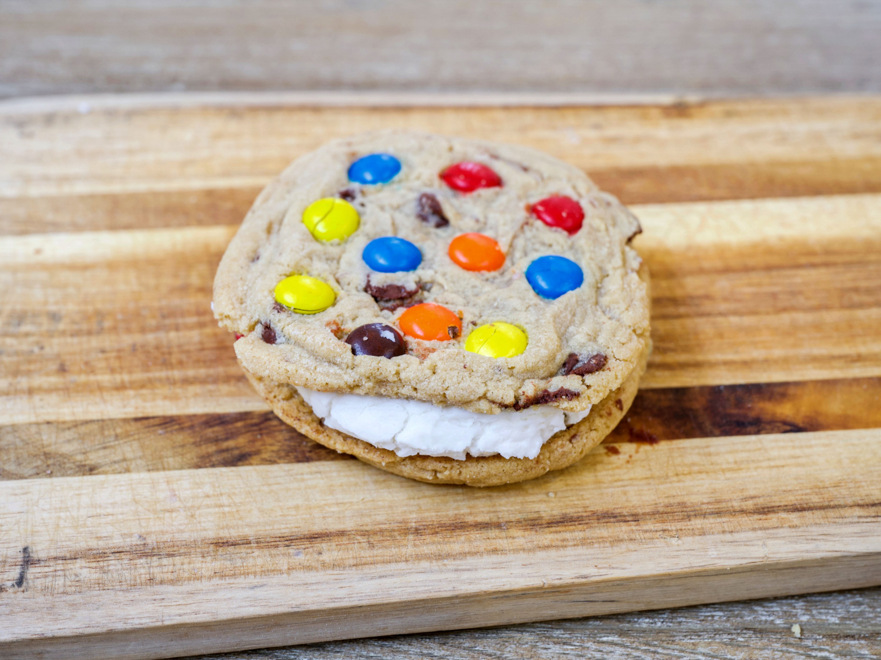 Order M&M Avalanche Cookie food online from Mary Mountain Cookies store, Broomfield on bringmethat.com