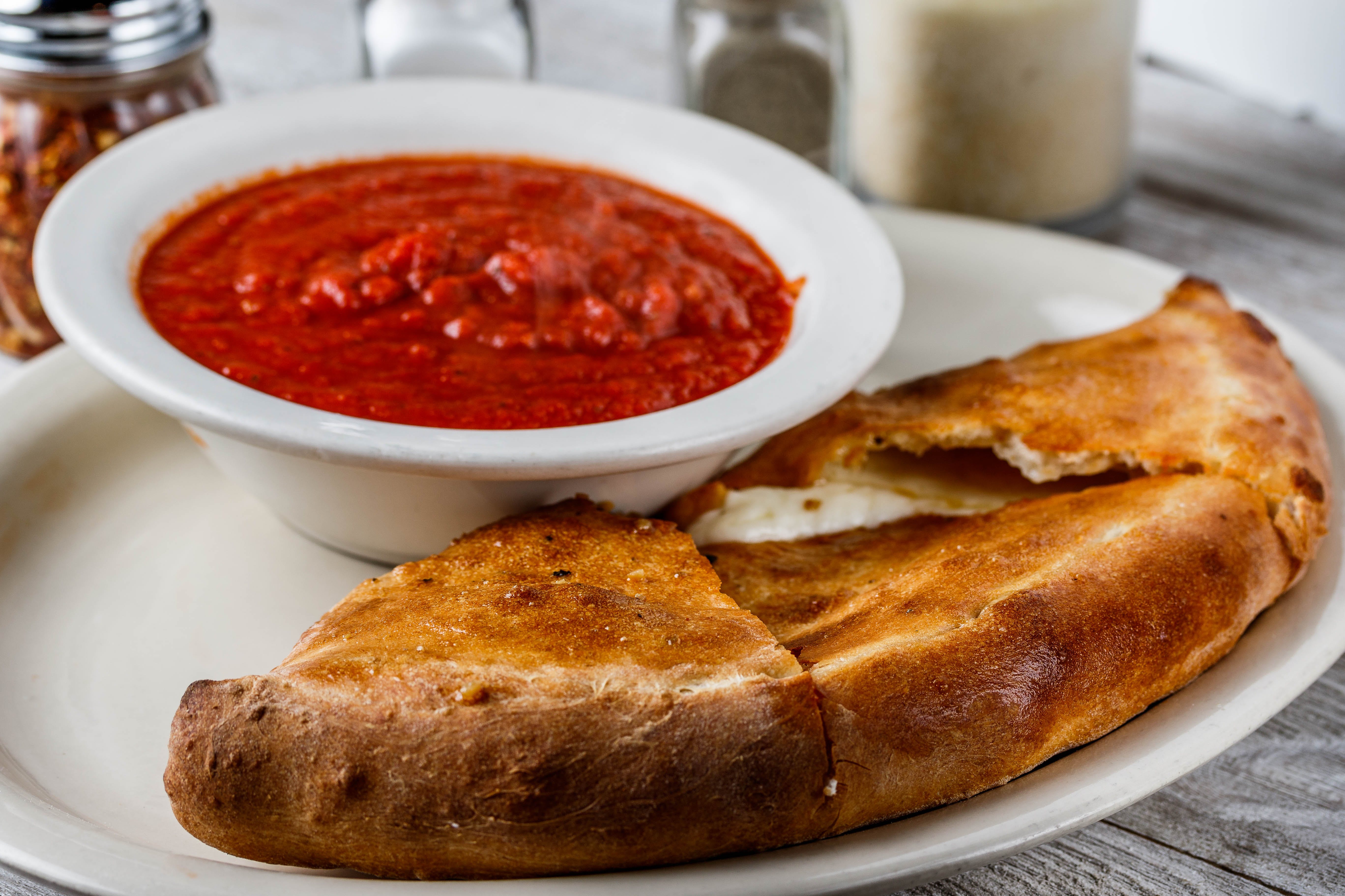 Order Cheese Calzone - Calzone food online from Mario Pizza & Pasta store, Seabrook on bringmethat.com