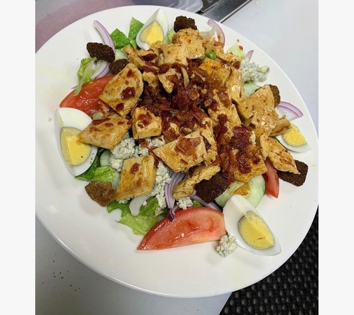 Order Gorgonzola Cajun Chicken Salad - Small food online from Hometown Pizza Of Southbury store, Southbury on bringmethat.com