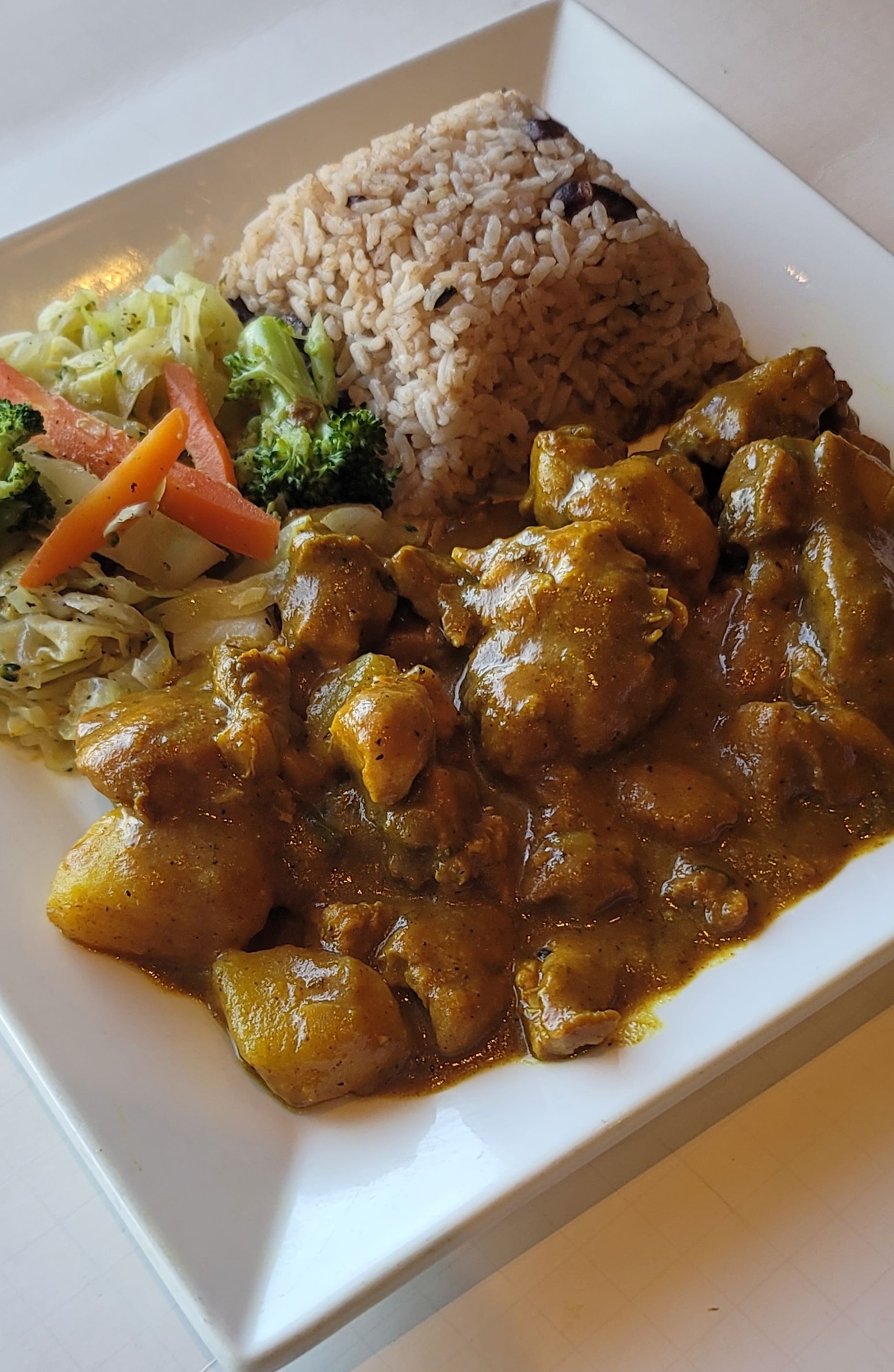 Order Curry Chicken food online from Paradise Place Jamaican Cuisine store, Las Vegas on bringmethat.com