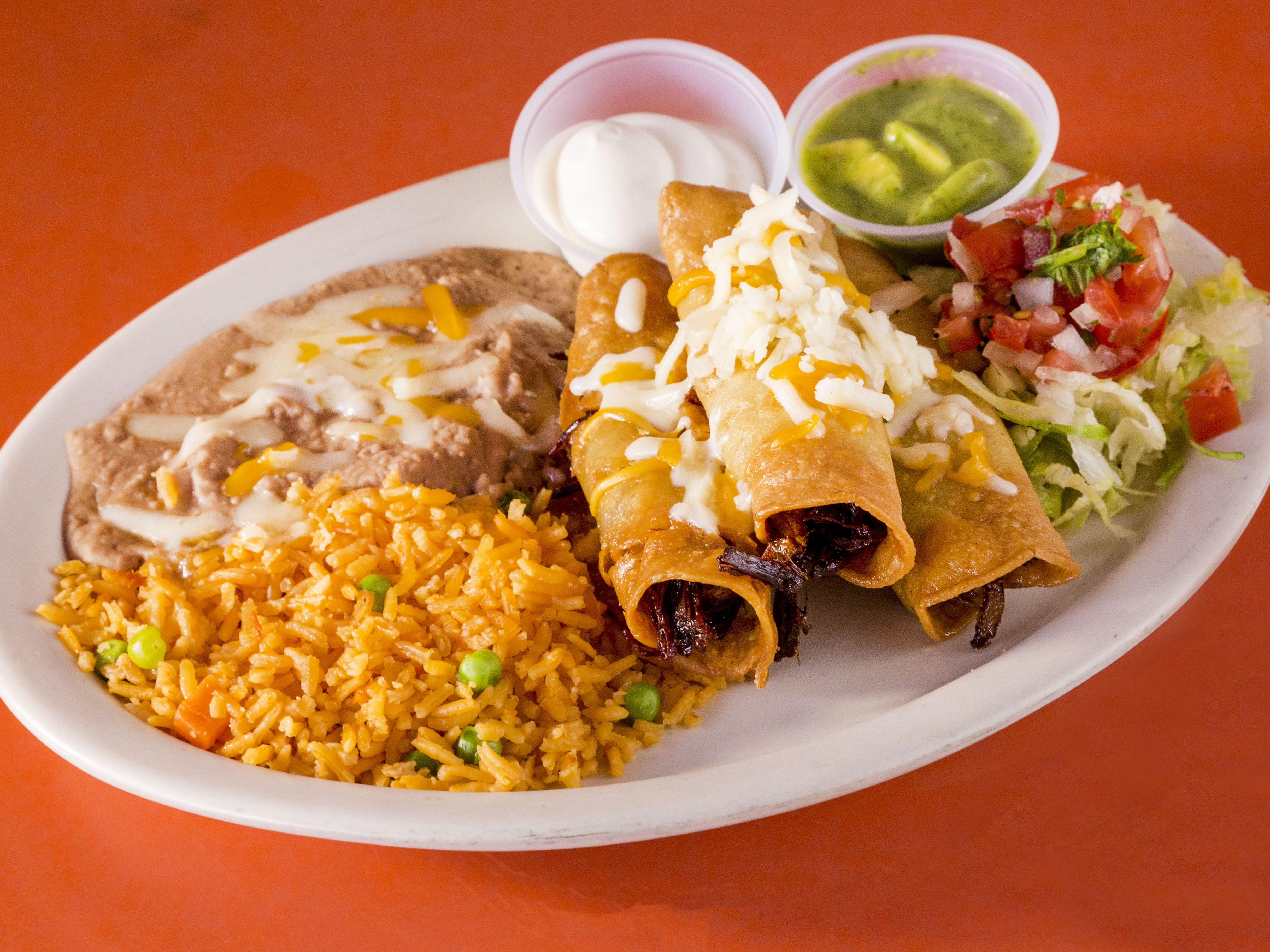 Order  Three Rolled Tacos Plate food online from Taqueria Los Angeles store, Peoria on bringmethat.com