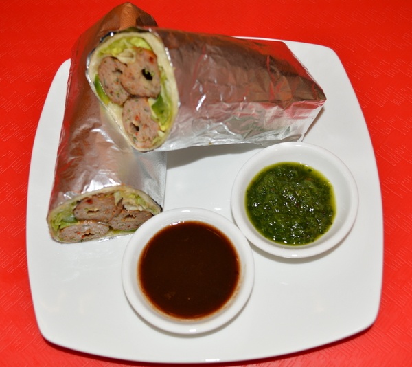 Order Spicy Seekh Kabab Kaati Roll food online from Chaats & Currys store, Sunnyvale on bringmethat.com
