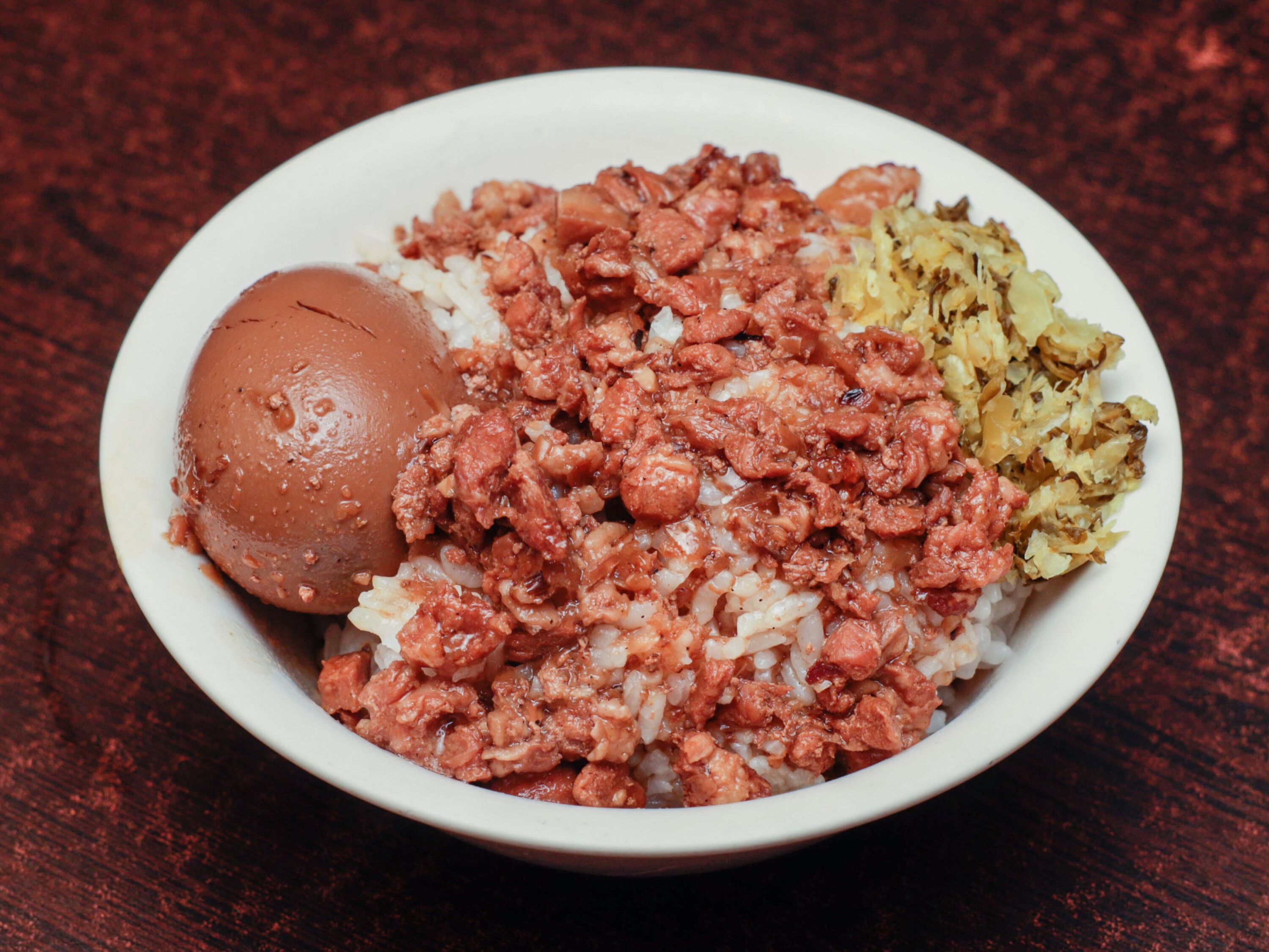 Order Braised Pork Sauce Rice & Braised Egg 滷肉飯 food online from A&J Bistro 半畝園 store, East Hanover on bringmethat.com