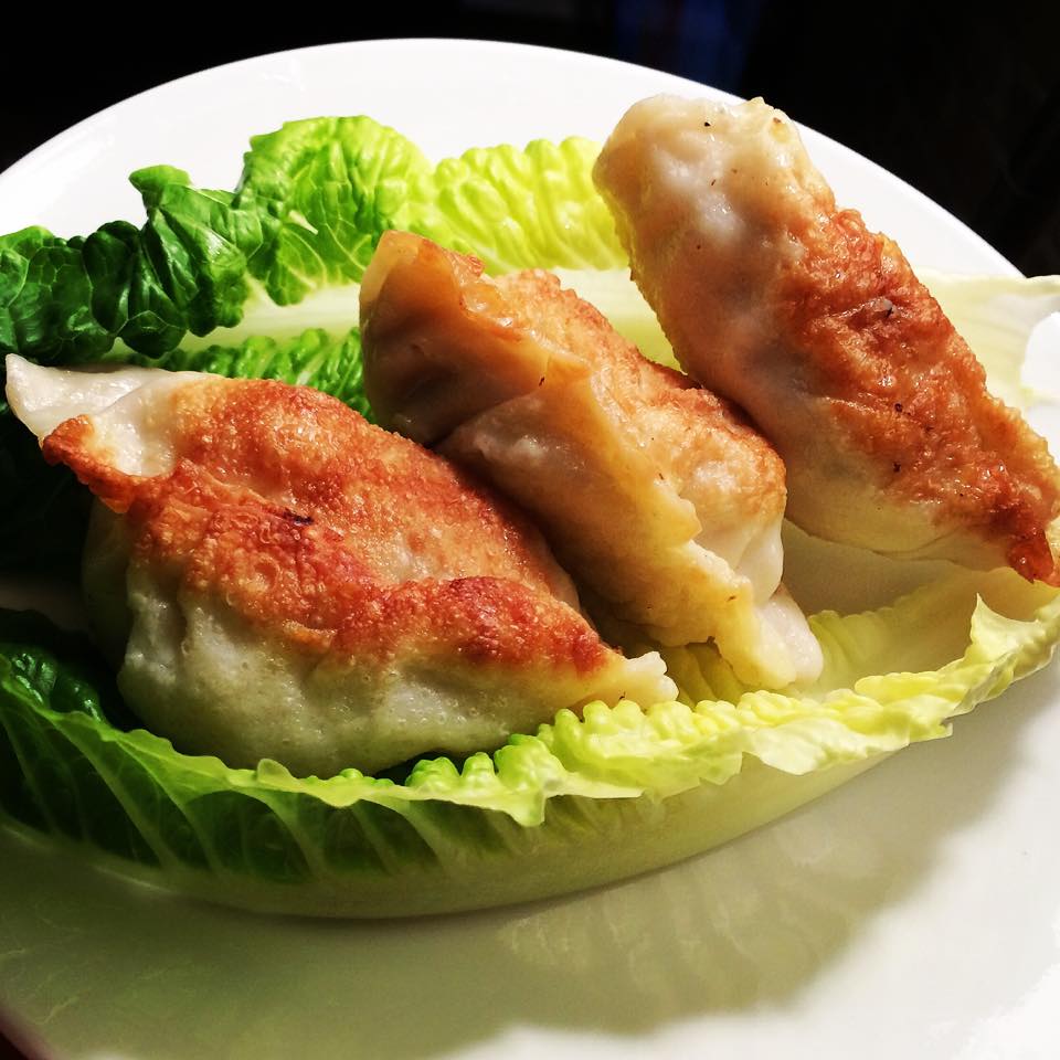 Order Pan Fried Dumplings food online from May Dragon Chinese Restaurant store, Dallas on bringmethat.com