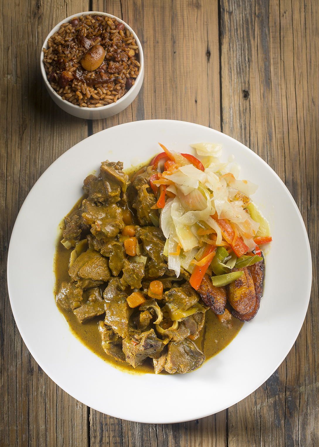 Order Curry Goat food online from Mr. Brown Lounge store, Chicago on bringmethat.com