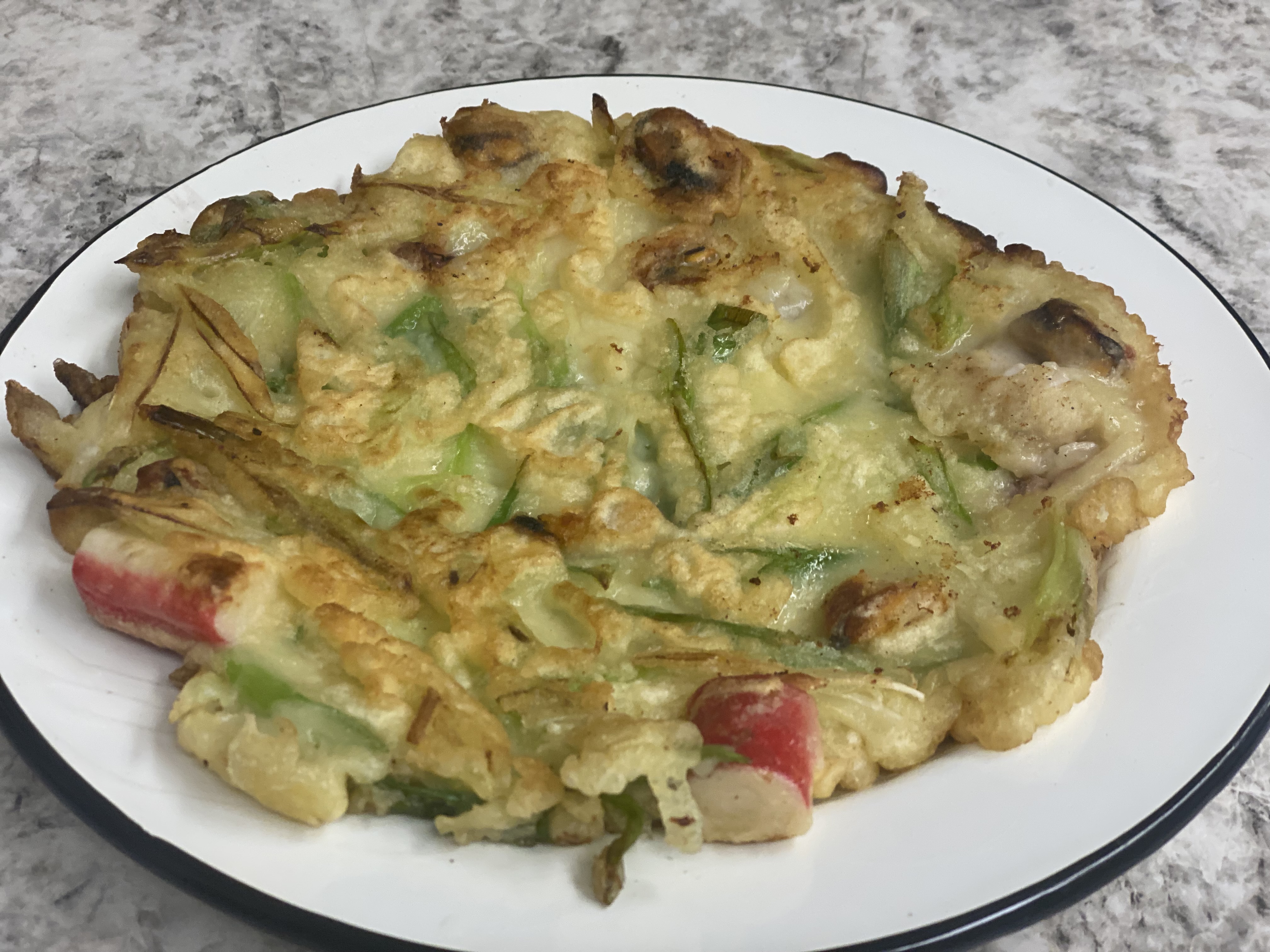 Order SN19. Haemul Pajeon (Korean Seafood Pancake) 韓式海鮮煎餅 food online from Uncle Chen Primetime store, State College on bringmethat.com