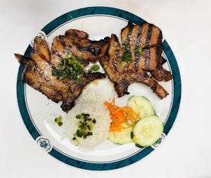 Order 70. Pork Chop on Broken Rice food online from Lido Restaurant store, Oklahoma City on bringmethat.com