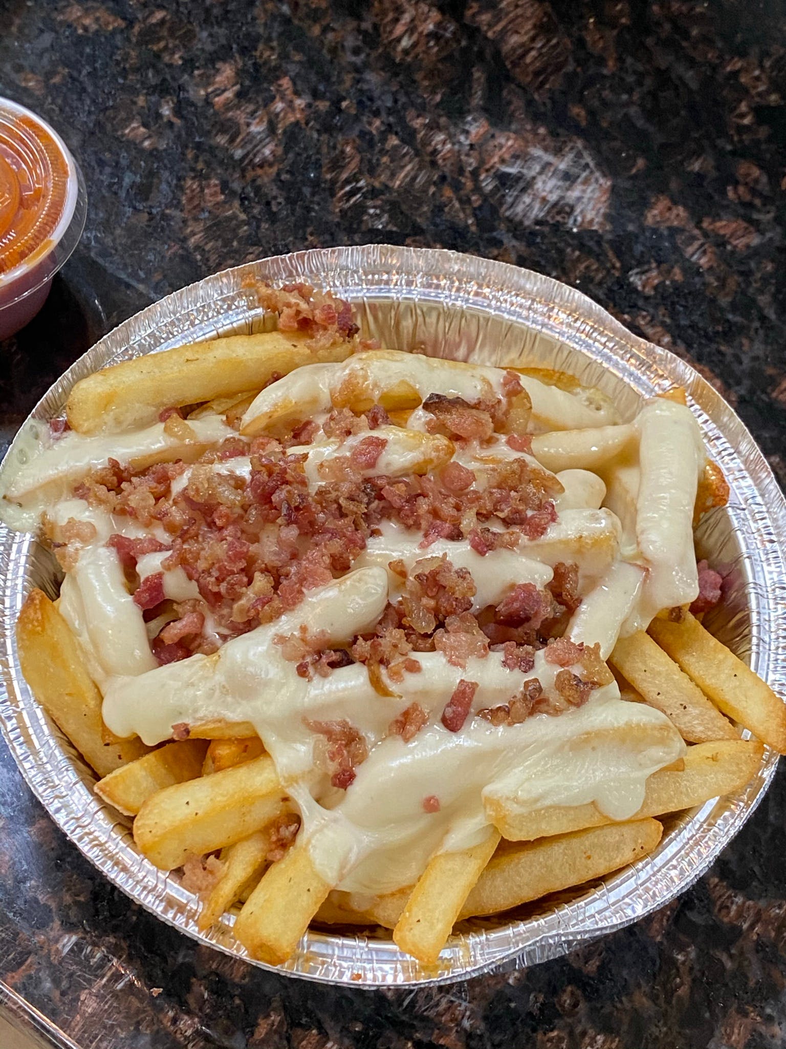 Order French Fries with Bacon & Cheese - Appetizer food online from Marcello's Pizza store, Paterson on bringmethat.com