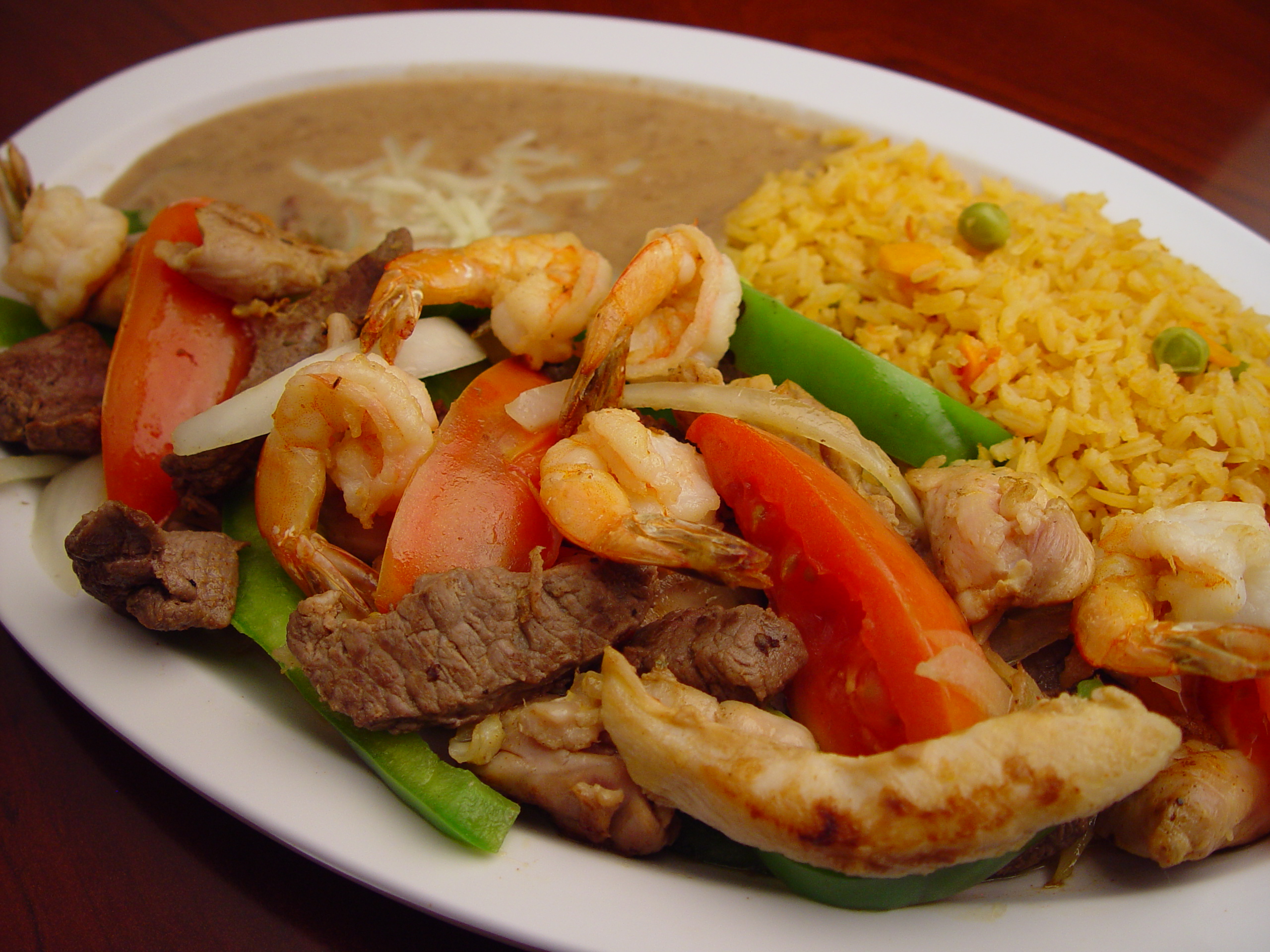 Order Steak, Chicken and Shrimp Fajitas food online from Rodeo Mexican Grill store, Los Angeles on bringmethat.com