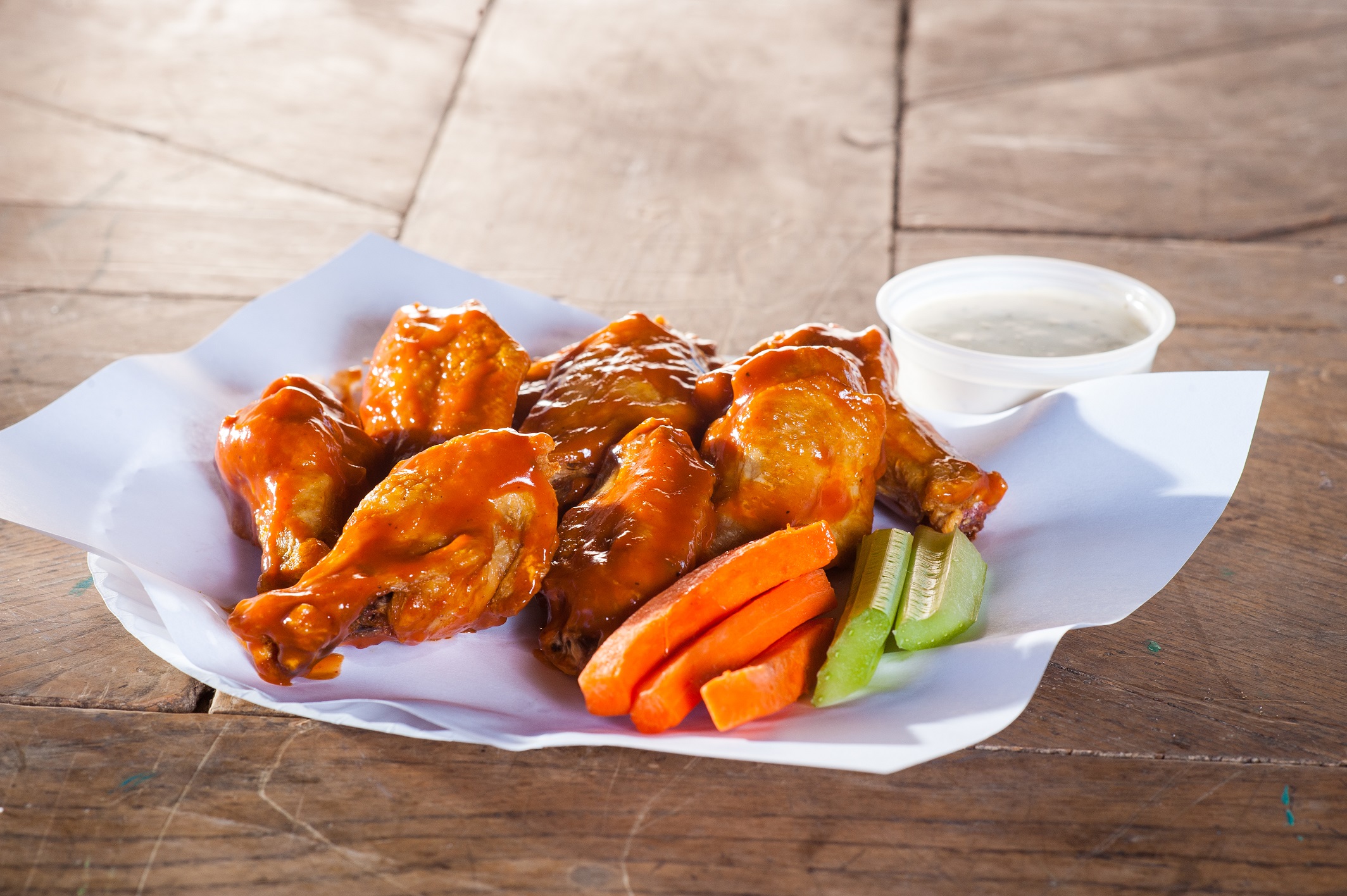 Order Traditional Bone In Buffalo Chicken Wings  food online from Mama Famous Pizza & Heros store, Tucson on bringmethat.com