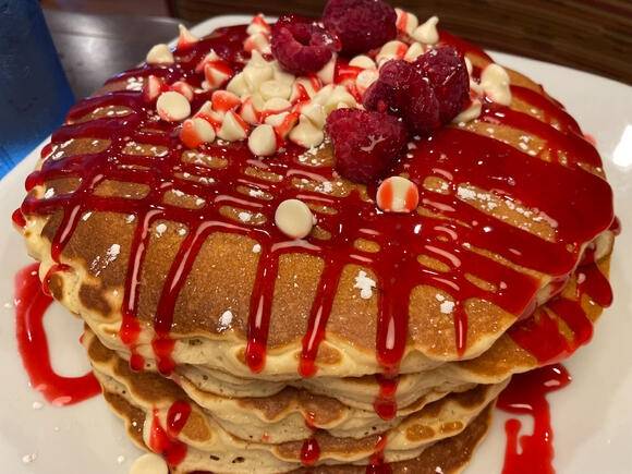 Order Raspberry White Chocolate Pancakes food online from Honey-Jam Cafe store, Arlington Heights on bringmethat.com