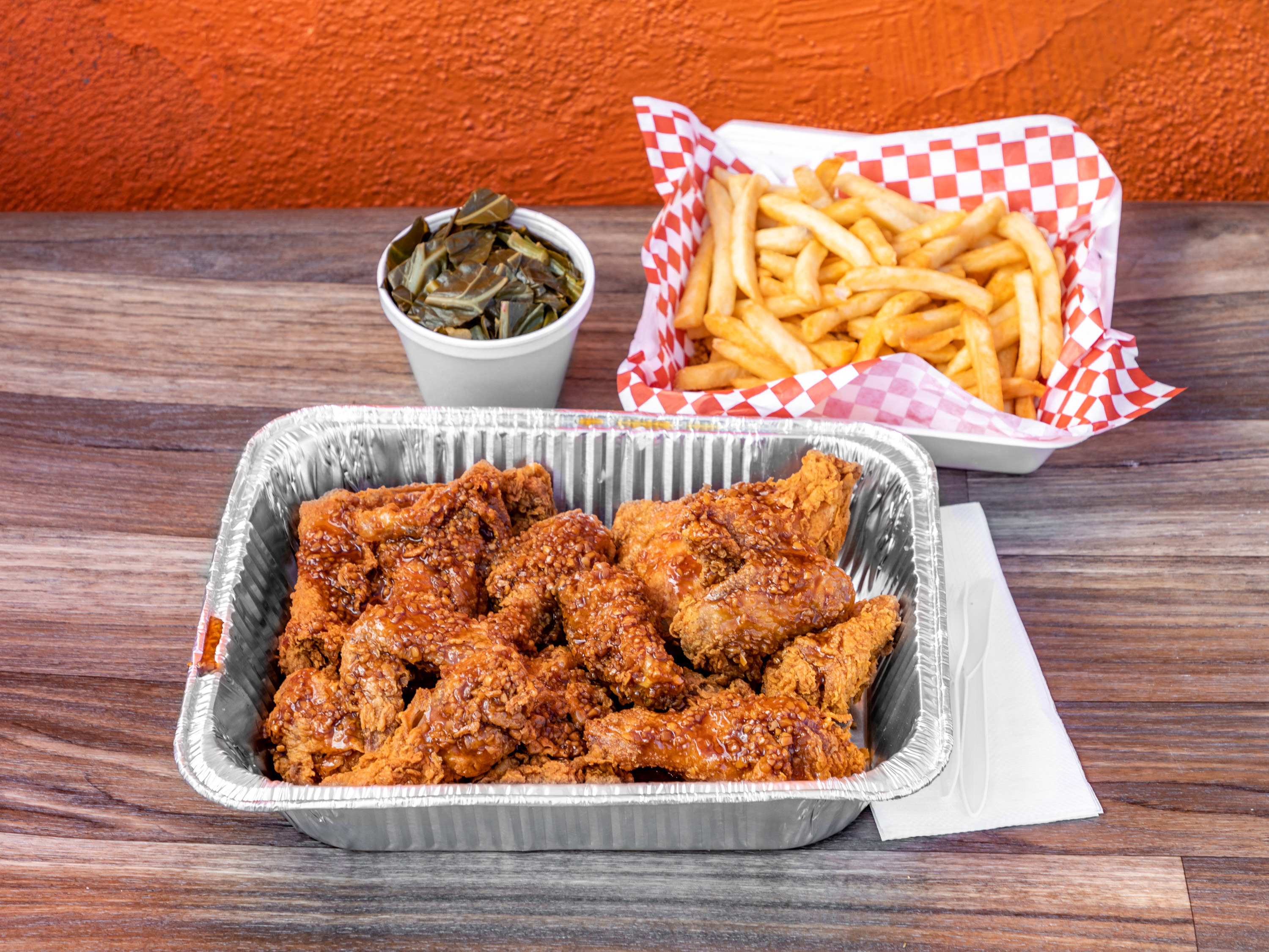 Order 20 Piece Soy Garlic Chicken and 2 Large Sides food online from Charlie Famous Fried Chicken store, Los Angeles on bringmethat.com