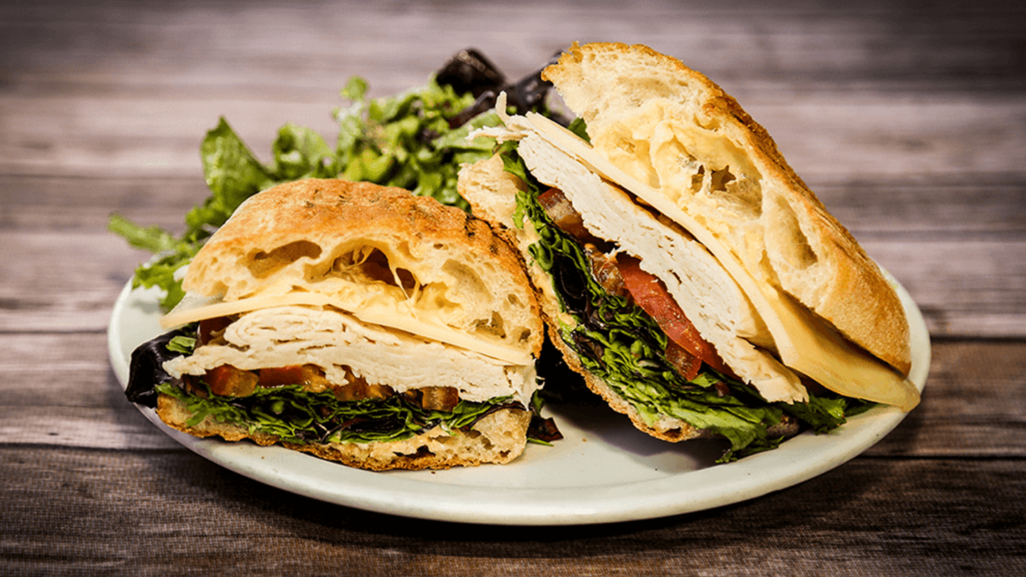 Order Oven Roasted Turkey Panini food online from Coupa Cafe store, Stanford on bringmethat.com