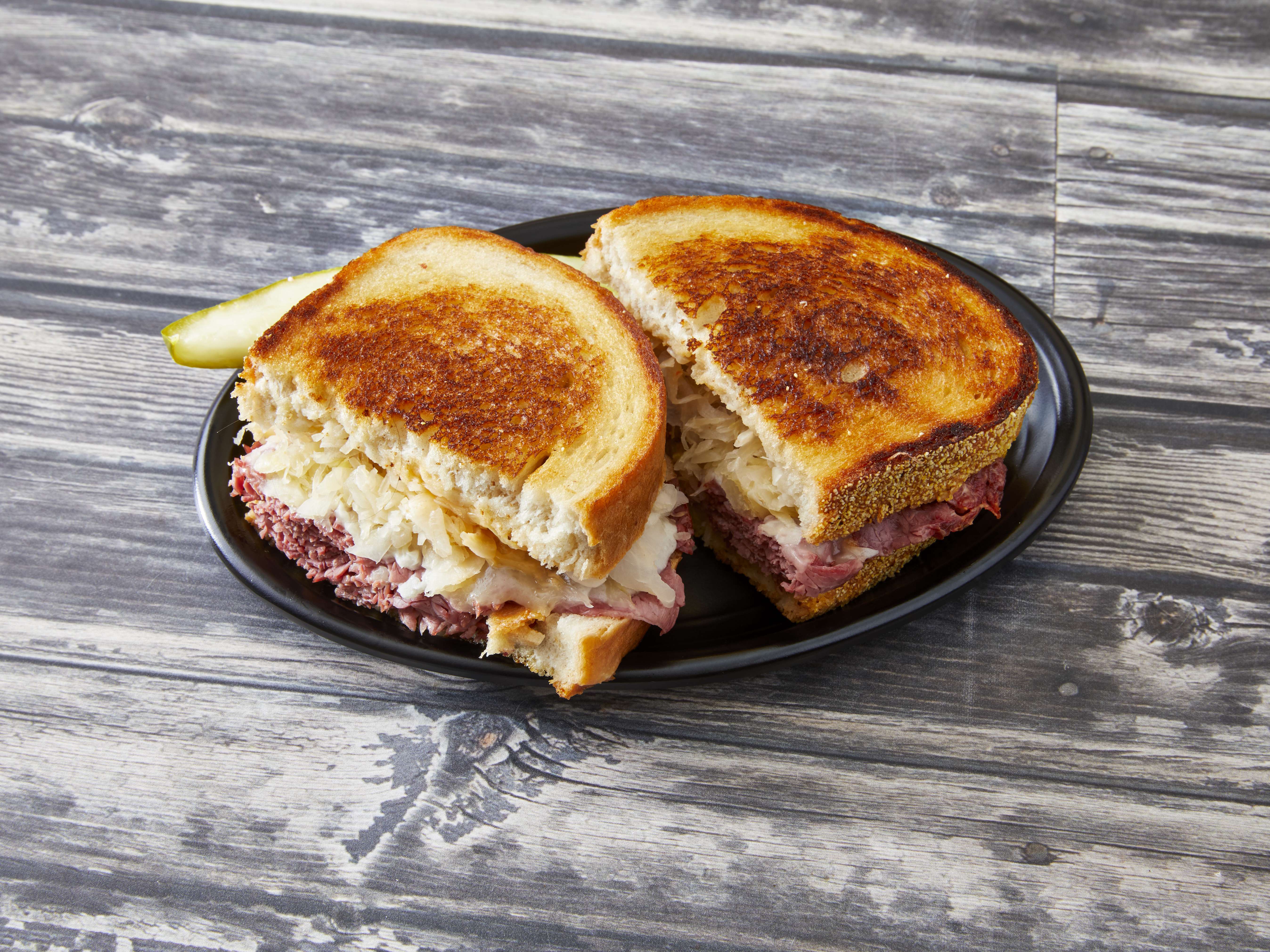 Order 4. Reuben Sandwich food online from Metro Deli & Grill store, Southfield on bringmethat.com