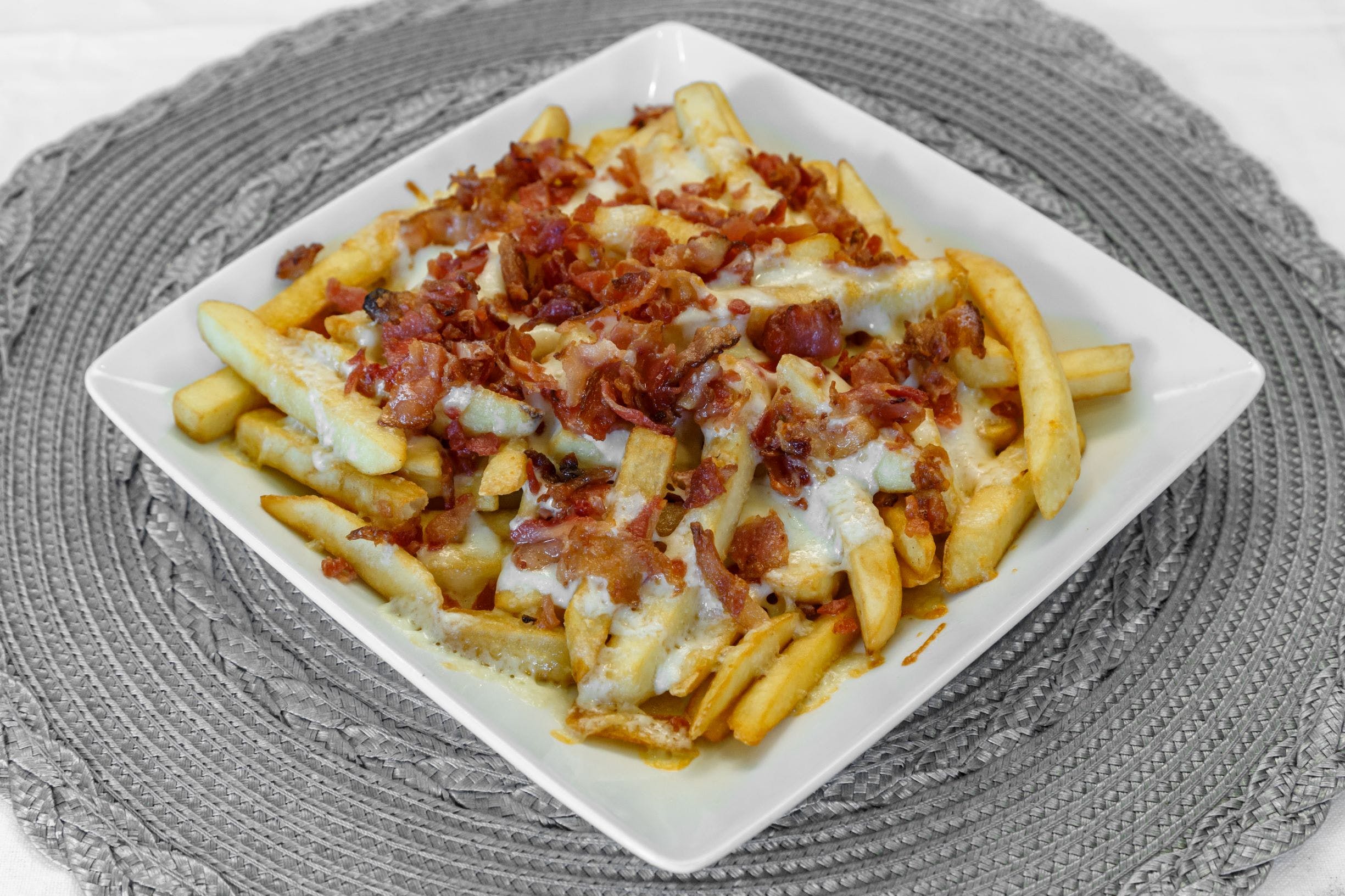 Order French Fries with Cheese & Bacon - Appetizer food online from Pizza Pronto store, Pittsburgh on bringmethat.com