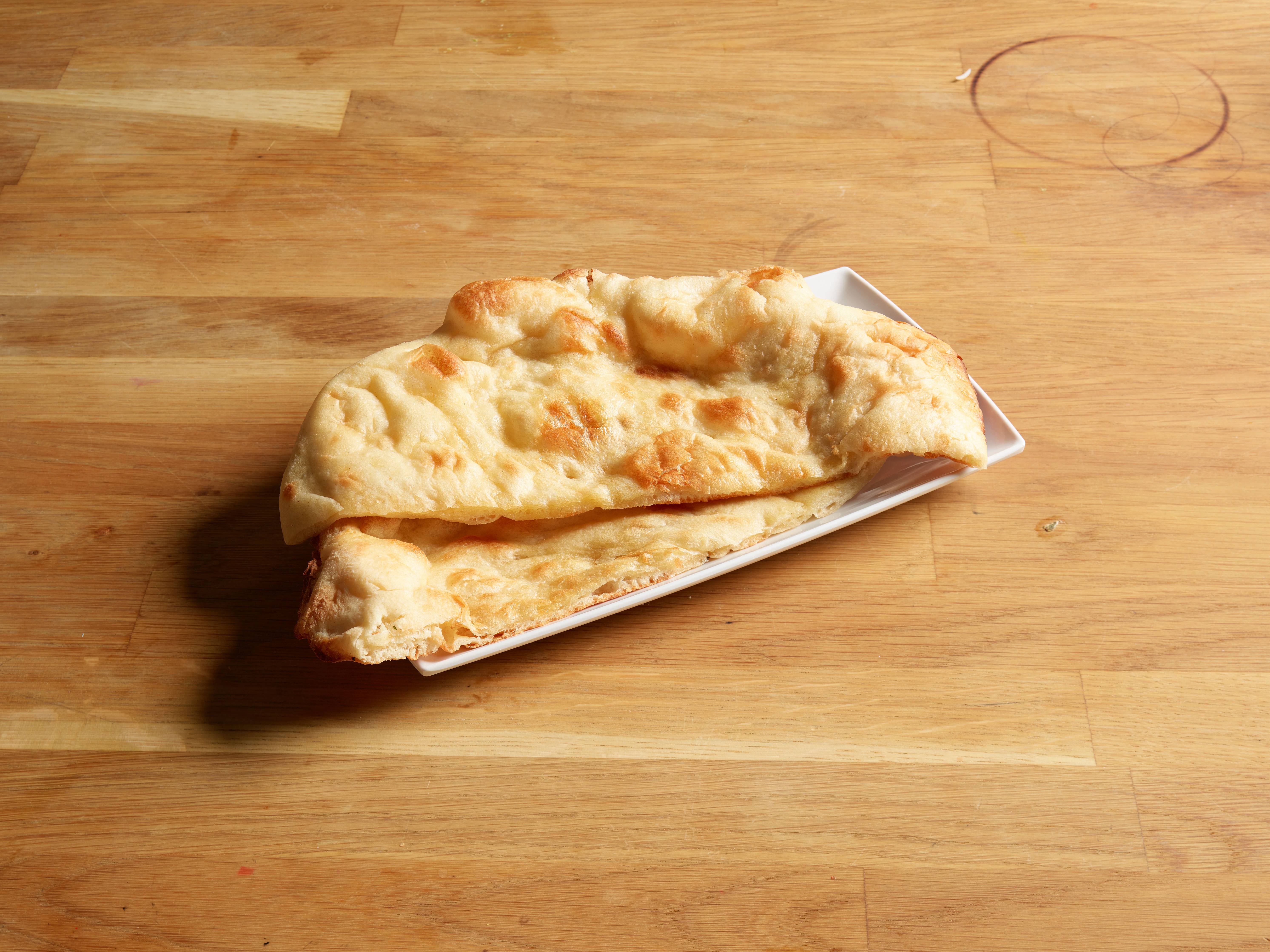Order Traditional Naan food online from Everest Tikka House store, Moorhead on bringmethat.com