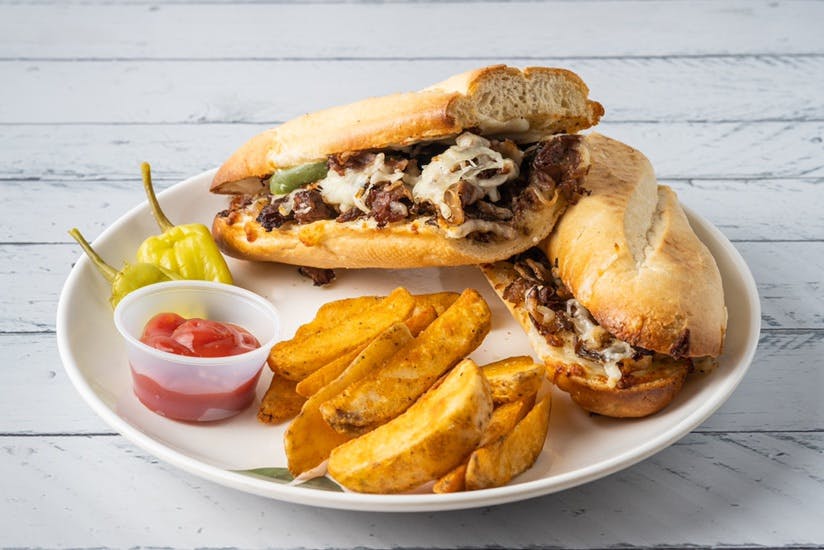 Order Philly Cheese Steak Sandwich with Wedges - Large food online from Pietros Italian store, Riverside on bringmethat.com