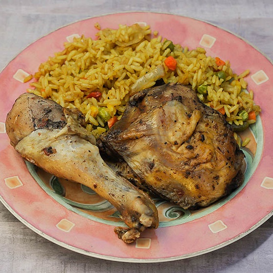 Order Jerk Leg Quarters with Fried Rice food online from Flavors Of Africa store, Lilburn on bringmethat.com