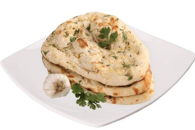 Order Garlic Naan food online from Flavours store, Omaha on bringmethat.com