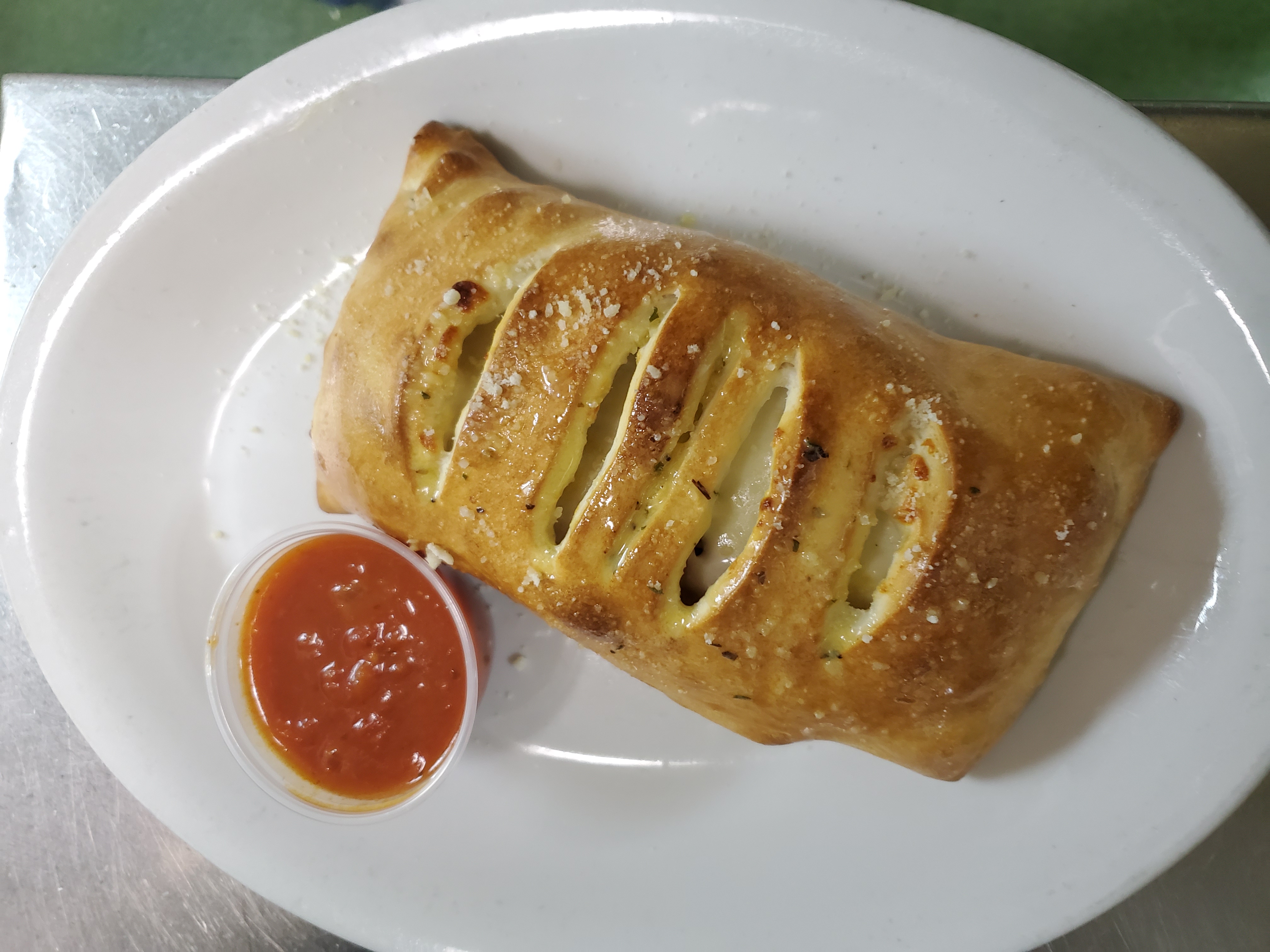 Order Stromboli with Pepperoni, Sausage and Cheese food online from Pepes Pizza store, North Richland Hills on bringmethat.com