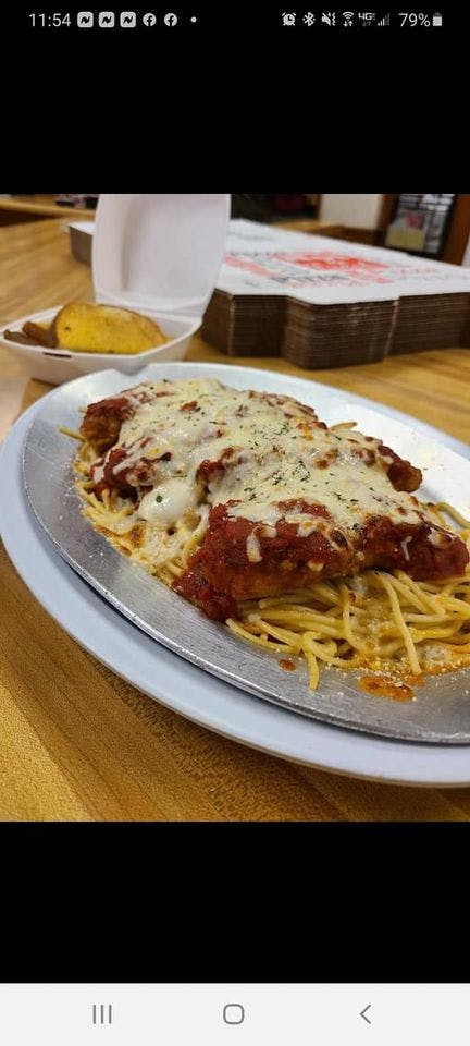 Order Chicken Parmigiana Over Pasta - Dinner food online from Giuseppe's Pizza Shop store, Plattsburgh on bringmethat.com
