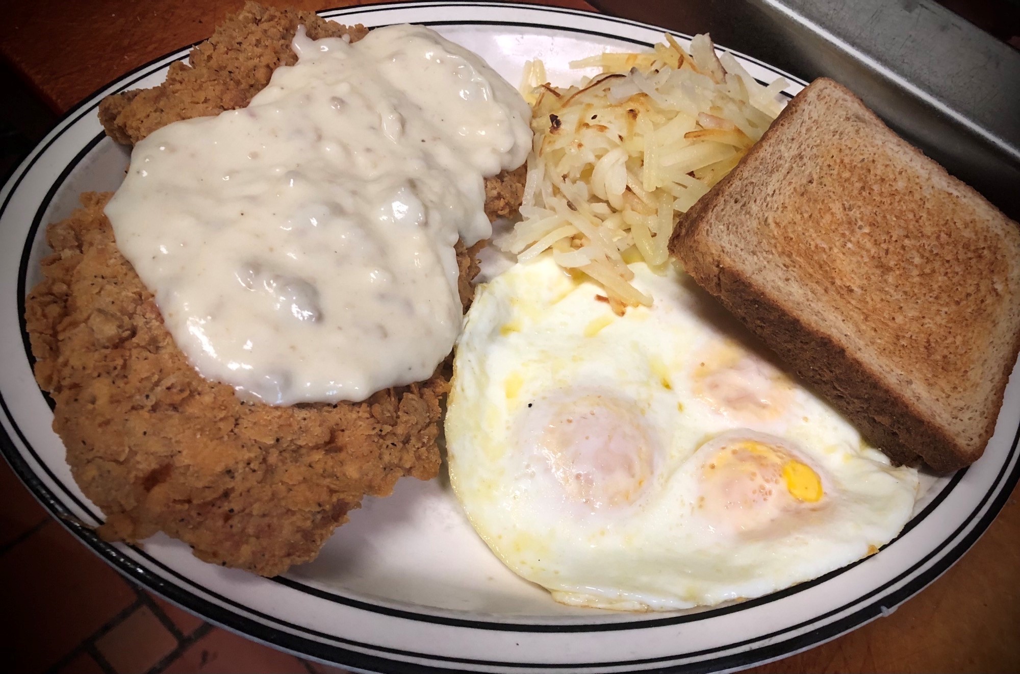 Order Fried Pork Chop and Eggs food online from Homestyle Cafe store, Springfield on bringmethat.com