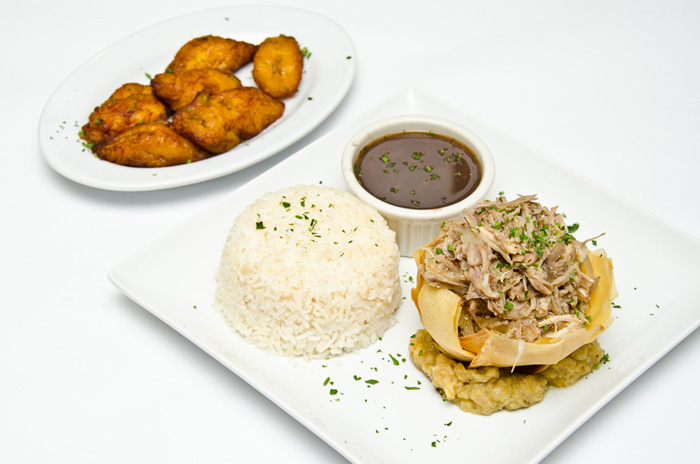 Order Lechon Asado con Mojo Criollo food online from Madera Cuban Grill store, Long Island City on bringmethat.com