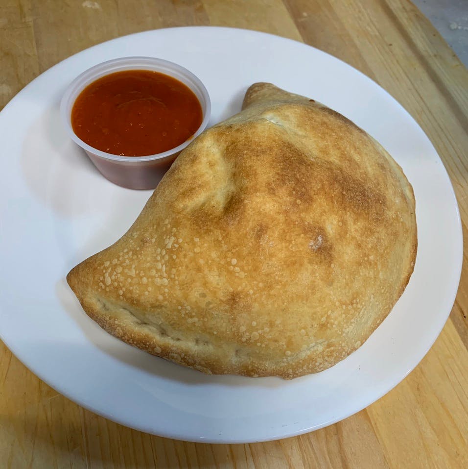 Order Veal Calzone - Calzone food online from Davila's Pizza & Restaurant store, Hackettstown on bringmethat.com