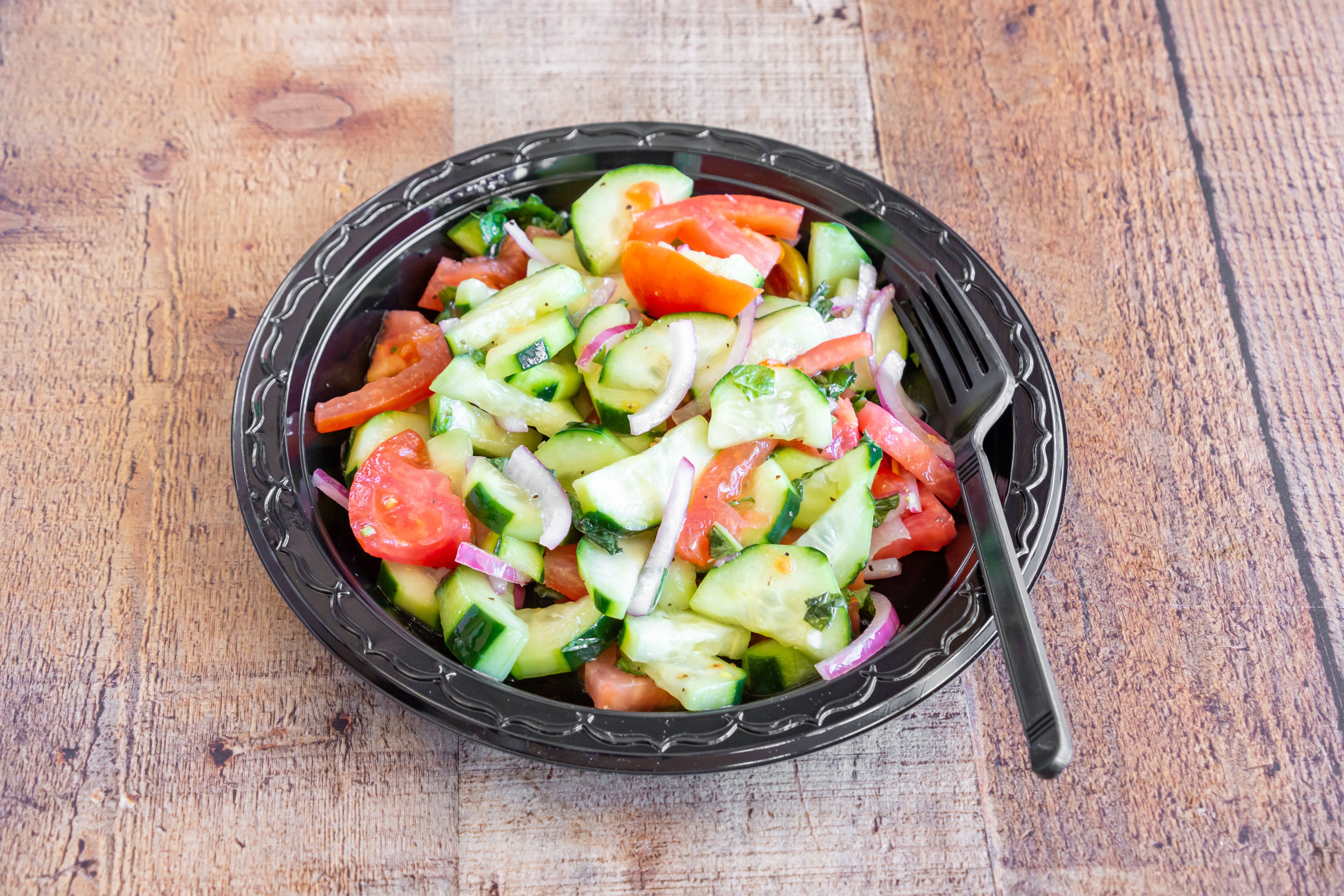 Order Cucumber Tomato Salad - Personal food online from Bravo Pizza store, Pottstown on bringmethat.com