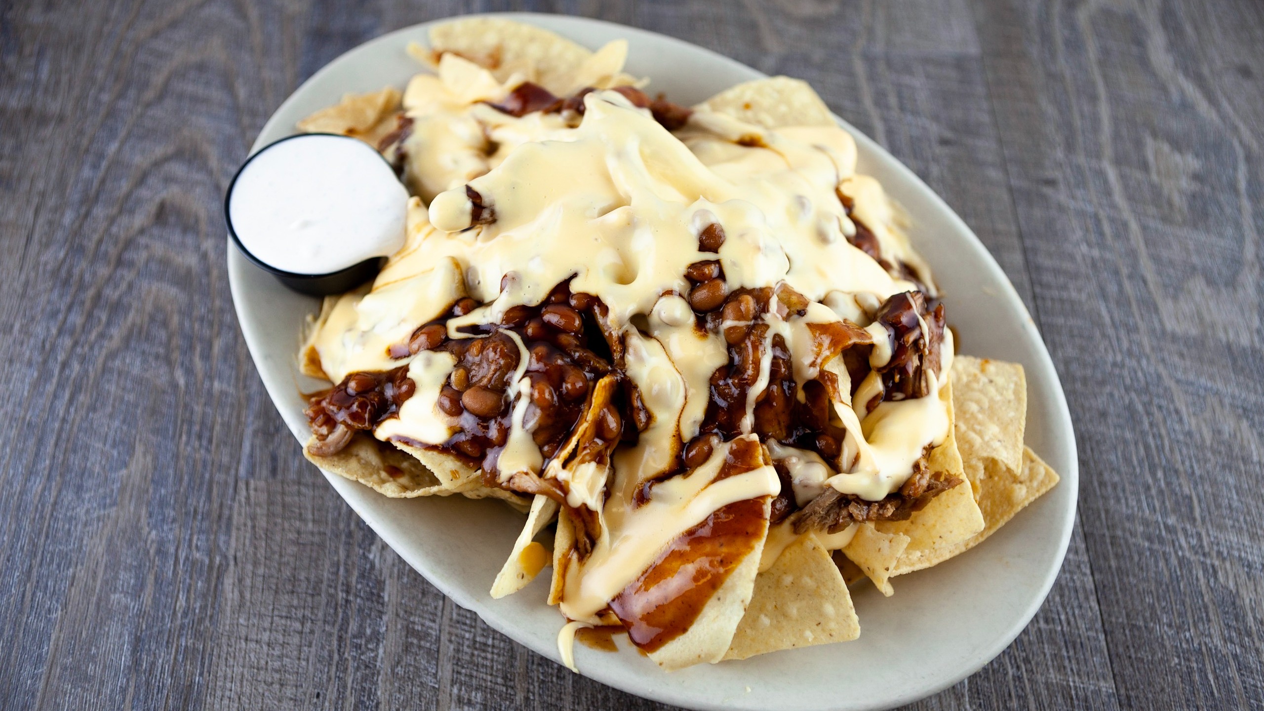 Order Pulled Pork Nachos food online from Fitz's store, University City on bringmethat.com