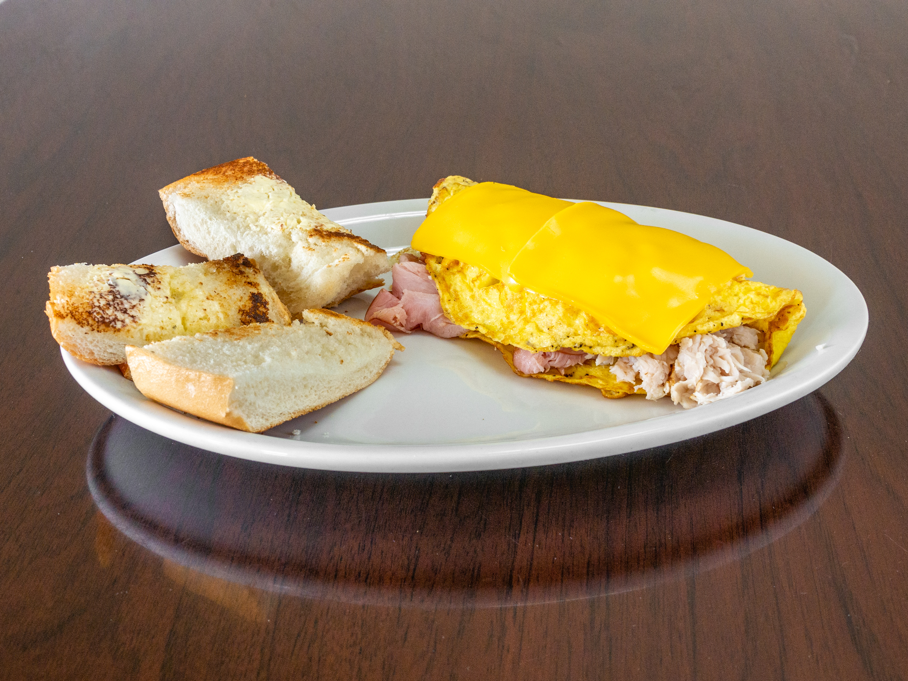 Order 13. Turkey and Ham Omelette food online from Robbie Sandwiches store, Capitola on bringmethat.com