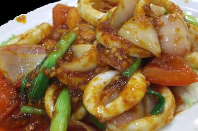 Order E1. Assam Calamari food online from Secret Recipe Asian Bistro store, Plano on bringmethat.com
