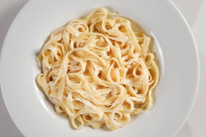 Order FETTUCCINE ALFREDO food online from Macaroni Grill store, Strongsville on bringmethat.com