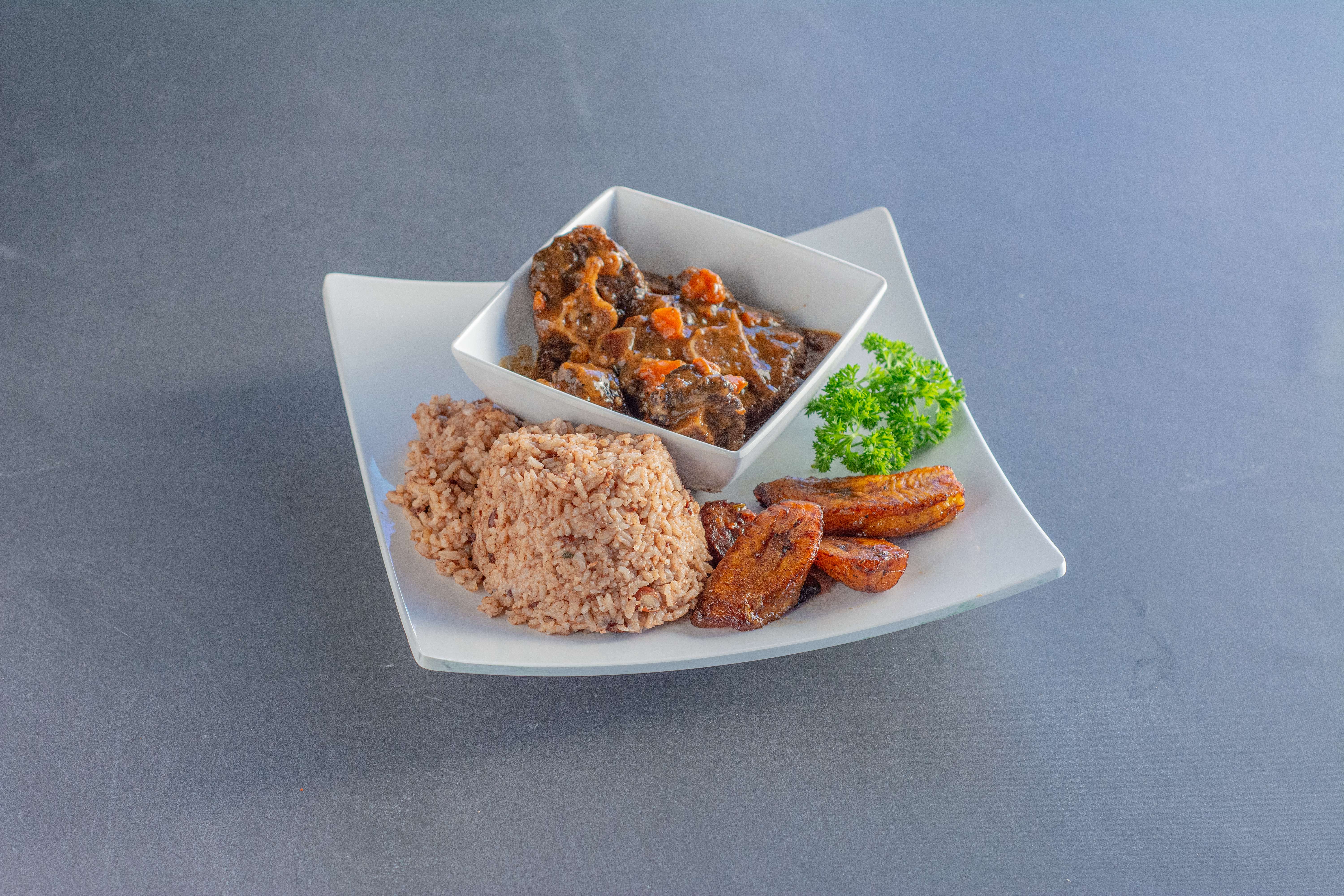 Order Braised Oxtail food online from Flavas Jamaican Grill store, South San Francisco on bringmethat.com