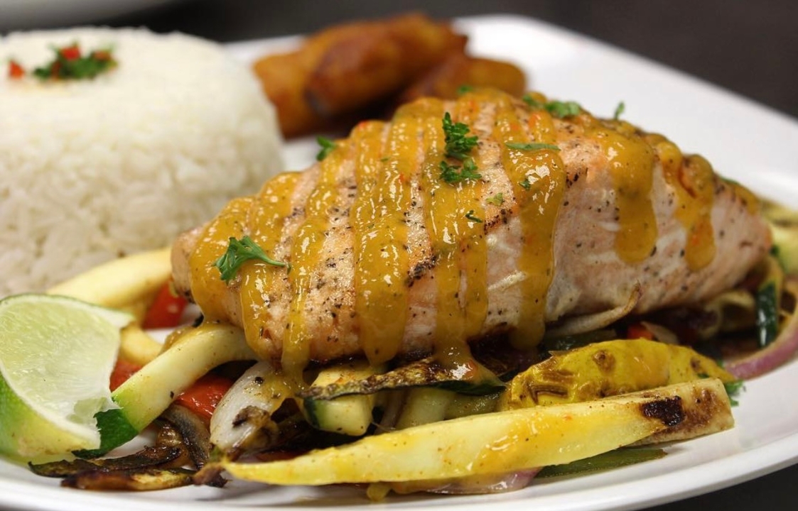 Order SALMON A LA PLANCHA food online from 90 Miles Cuban Cafe store, Chicago on bringmethat.com